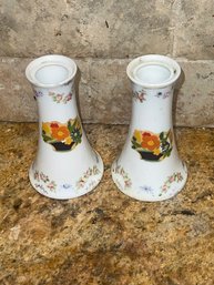 Pair Of Porcelain Floral Enhanced Candlesticks