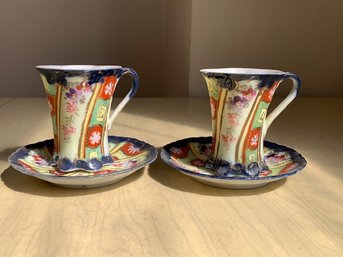 A Beautiful Pair Of Tea Cups And Saucers