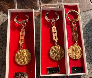 A Group Of Three Religious Key Chains In Box 24kt Gold Plated