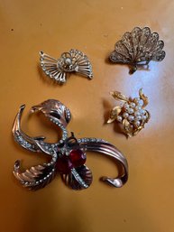 A Group Of 4 Retro Brooches.