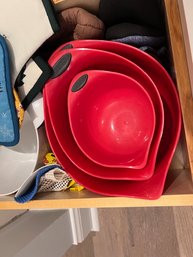 A Set Of Red Mixing Bowls