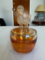 A Marigold Carnival Glass Poodle Trinket Box