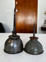 A Pair Of Vintage Oil Cans
