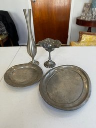 A Group Of Pewter And Tin Platters And Vase Etc
