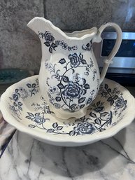A Blue And White Ceramic Pitcher And Bowl