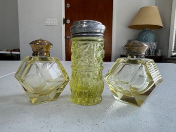 A Group Of Salt And Pepper Shakers Citrine Colored Vaseline Glass