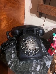 A Black Rotary Dial Bell Telephone Desk Style