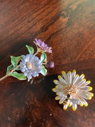 A Pair Of Enamel Floral Pins