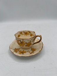 Diminutive Gold Enhanced  Porcelain Tea Cup And Saucer Made In France