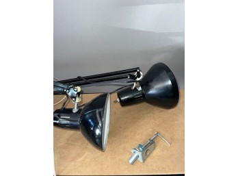 A Pair Of Black Luxo Clamp On Desk Lamps