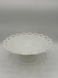 A Footed Milk Glass Cake Plate With Open Lattice Border