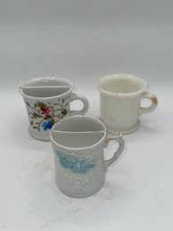 A Group Of Mustache Cups And One Milk Glass Mug