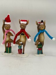 A Group Of 3 Ceramic Christmas Elves