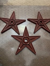 A Group Of 3 Red Cast Iron Building Stars