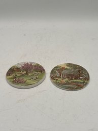 A PAIR OF CURRIER AND IVES CERAMIC PLAQUES