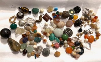 A Mixed Group Of Beads, Stones Buttons Etc