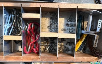 A Divided Drawer With Multiple Rubber Coated Hooks, Screw, Nuts, Hinges Etc
