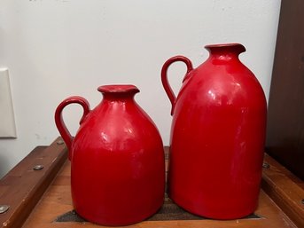 A Pair Of Red Ceramic Jusgs Approx 7 And 10' Tall