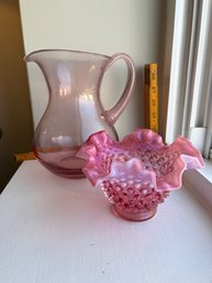 A Cranberry Opalescent Fenton Hobnail Ruffled Bowl And Pink Glass Hand Blown Pitcher