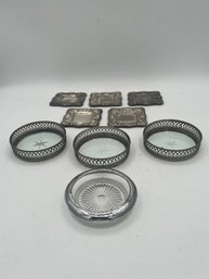 A Group Of Silver Plate And Glass Trivets/coasters