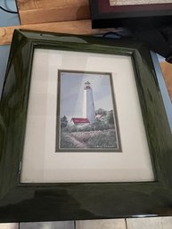 A Framed Print Of A Lighthouse  Approx 11 X 14