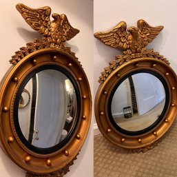 A Pair Of Reproduction Convex Americana Round Mirrors