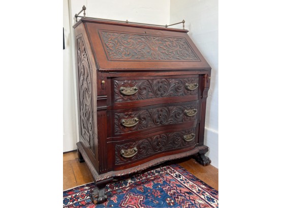 DEEP CARVED MAHOGANY SERPENTINE SLANT FRONT DESK