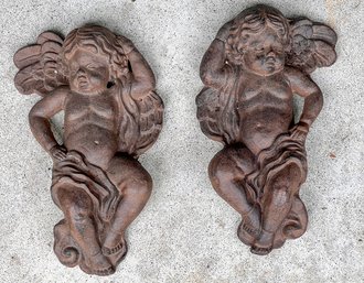 PAIR DECORATIVE PUTTI CAST IRON PLAQUES