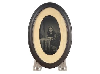 TIN TYPE OF A YOUNG GIRL PRESENTED in OVAL FRAME