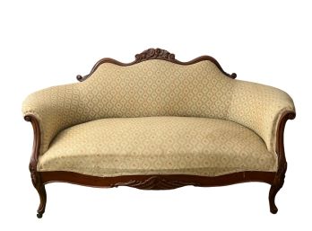 CARVED AND UPHOLSTERED VICTORIAN LOVE SEAT