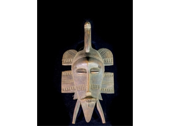 CARVED AFRICAN MASK WITH CRANE