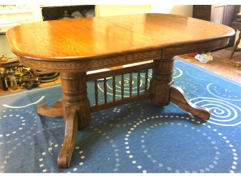 DOUBLE PEDESTAL OAK DINING TABLE W/ (1) LEAF