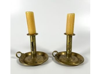 PAIR OF BRASS PUSH-UP CHAMBERSTICKS