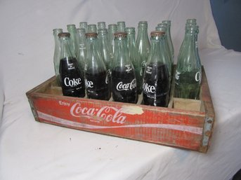 Coca Cola Bottles And Wooden Carrier