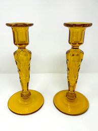 Pair Of Antique Amber Glass Candlesticks