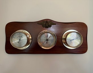 A Vintage Barometer, Thermometer, And Humidity Gauge