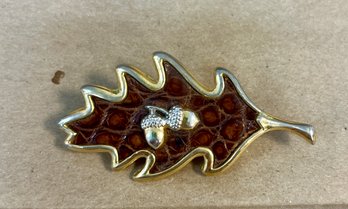 36. Gold Toned Oak Leap Pin