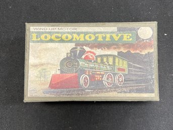 32. Tin Windup Locomotive Toy