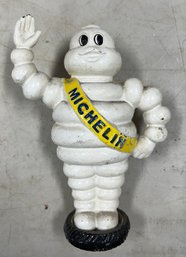 36. Cast Iron Michelin Man Standing On Tire