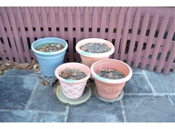 4 Plastic Planters On Rolling Stands