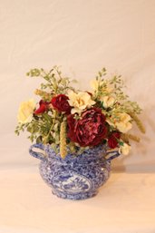 Faux Flowers In Blue And White Vase