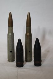 2 Inert .50 Cal Bullets And 2 Large Bullet Heads