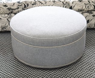Round Grey Upholstered Ottoman With Nailhead Trim