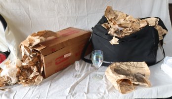 A Bag And A Box Of Glassware Wrapped In 1986