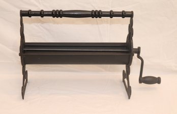 CAST IRON NEWSPAPER LOG ROLLER (J-26)