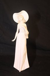 NAO BY LLADRO 292 GIRL WITH BASKET OF FLOWERS STRAW HAT FIGURINE. (J-93)