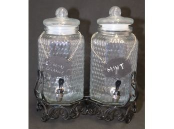 Pair Of Glass Beverage Dispensers On Metal Base With Chalkboard Signs