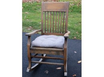 Wooden Rocking Chair Used Outside On A Covered Porch