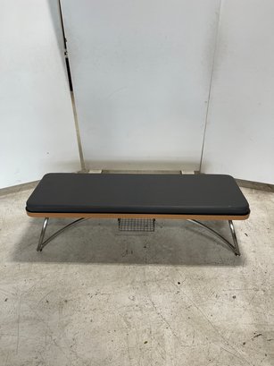 Padded Bench #3 With Chrome Leg And Small Metal Storage Basket Attached.