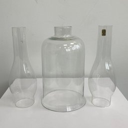 A Trio Of Clear Glass Lamp Shades.